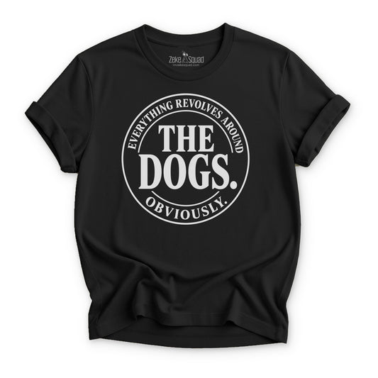 Maroon unisex graphic tee with a round emblem reading everything revolves around the dogs obviously, Bella Canvas 3001