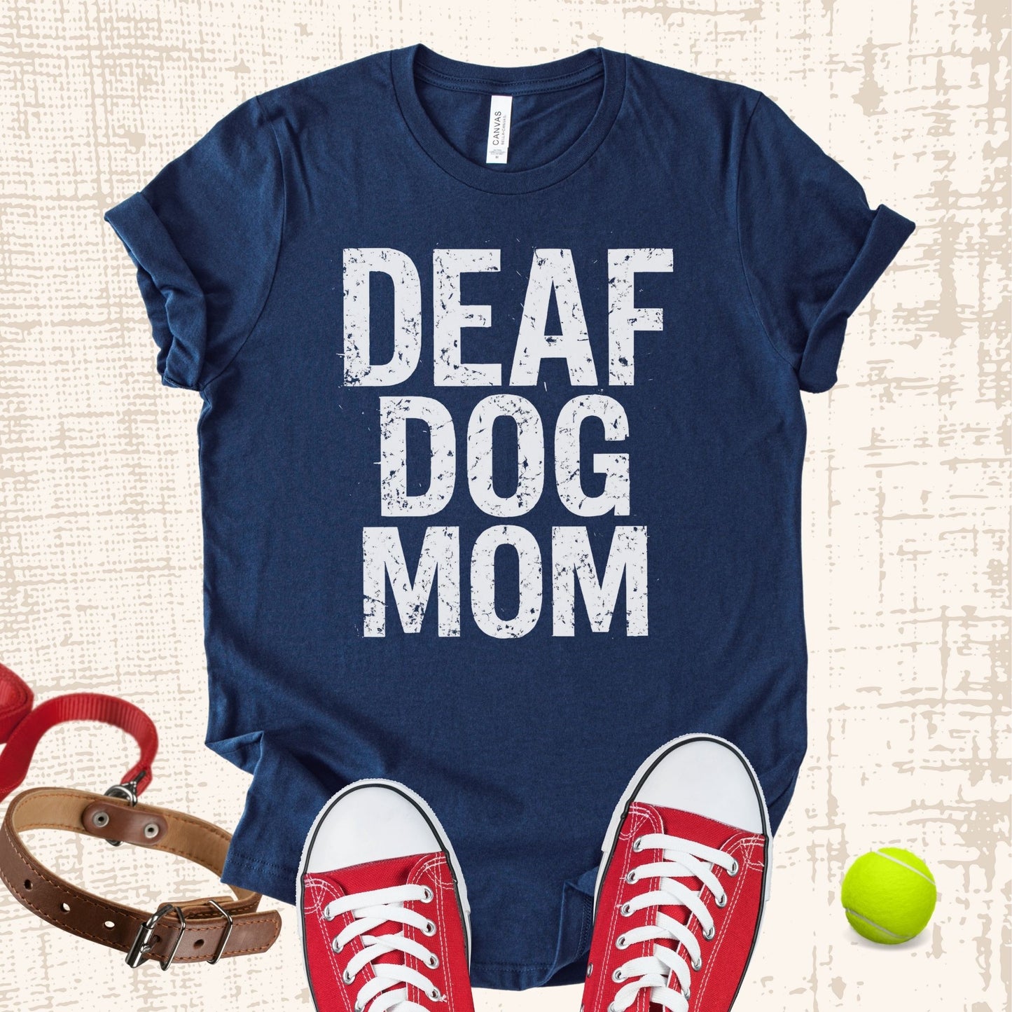 Unisex Zeke Squad T-shirt with the phrase “Deaf Dog Mama” for awareness and advocacy.