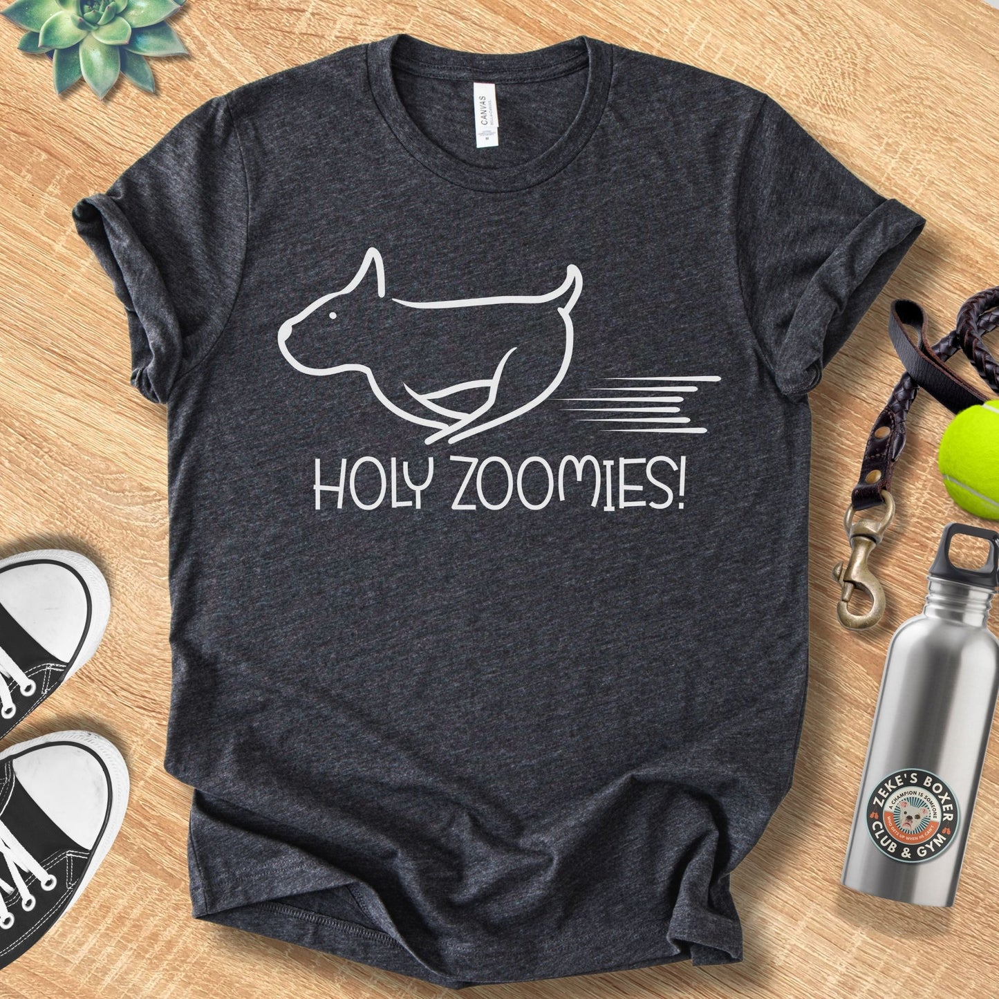 Unisex Zeke Squad t-shirt with the phrase “Holy Zoomies,” a funny dog-lover design celebrating playful chaos.