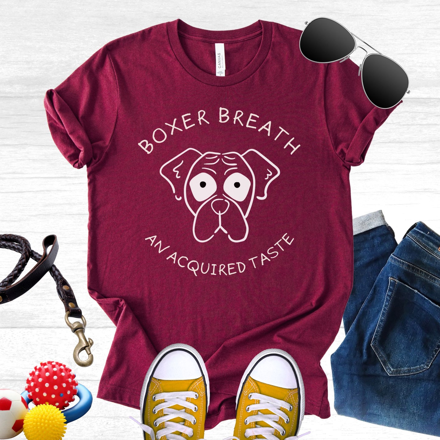 Unisex Zeke Squad T-shirt with the funny phrase “Boxer Breath: An Acquired Taste” celebrating Boxer dog parents.
