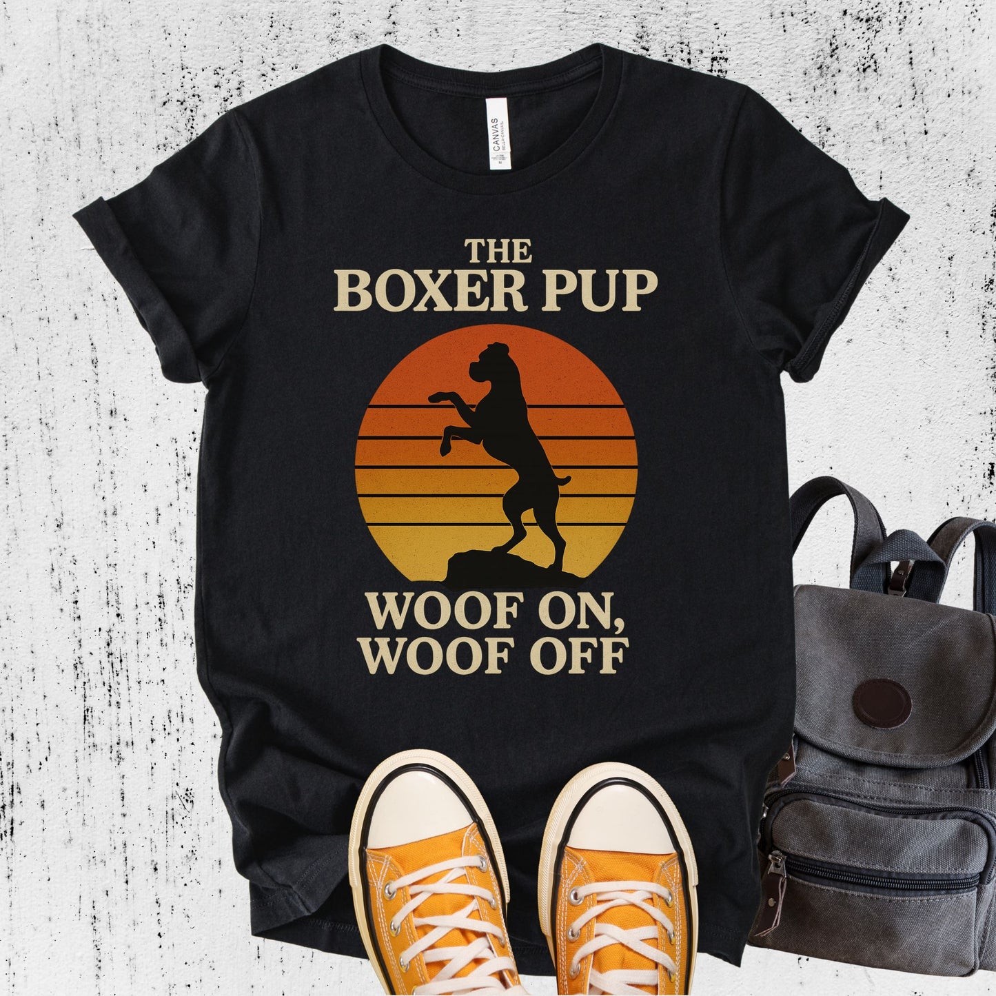 Unisex Zeke Squad T-shirt with the phrase “Boxer Dog” featuring a parody design of a boxer doing a karate chop in front of a retro sunset.