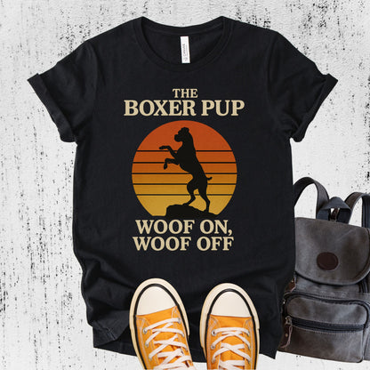 Unisex Zeke Squad T-shirt with the phrase “Boxer Dog” featuring a parody design of a boxer doing a karate chop in front of a retro sunset.