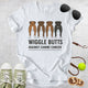 Unisex Zeke Squad T-shirt with the quote “Wiggle Butts Against Canine Cancer” featuring a row of dog booties.