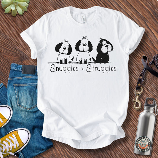 Unisex Zeke Squad t-shirt with the phrase “Snuggles > Struggles,” a heartfelt minimalist design for dog lovers and big feelers.