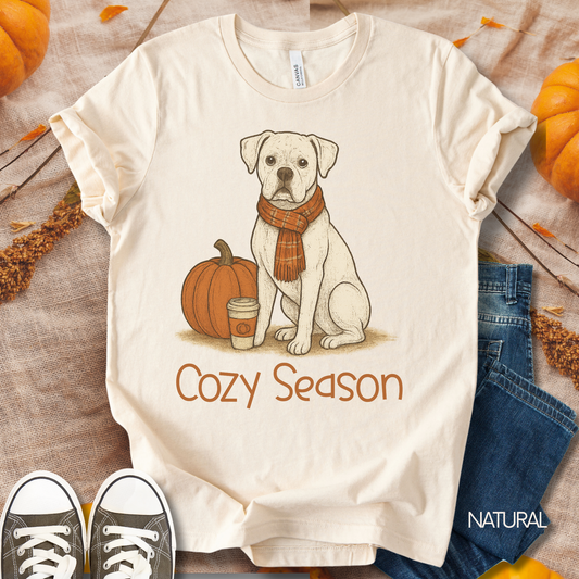 Unisex Zeke Squad fall t-shirt with the phrase “Cozy Season” featuring a white Boxer sitting with a cup of coffee.