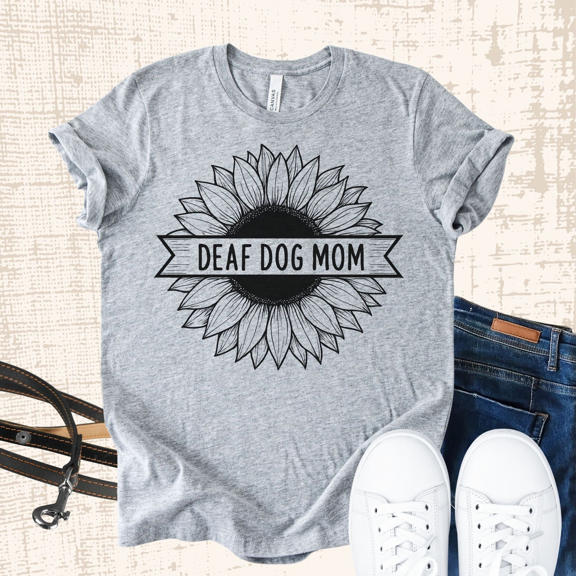 Unisex Zeke Squad T-shirt with the bold phrase “Deaf Dog Mom” for proud dog parents.