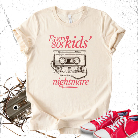 Unisex Zeke Squad T-shirt with the phrase “Every 80s Kid Nightmare” featuring an unwound cassette tape design.