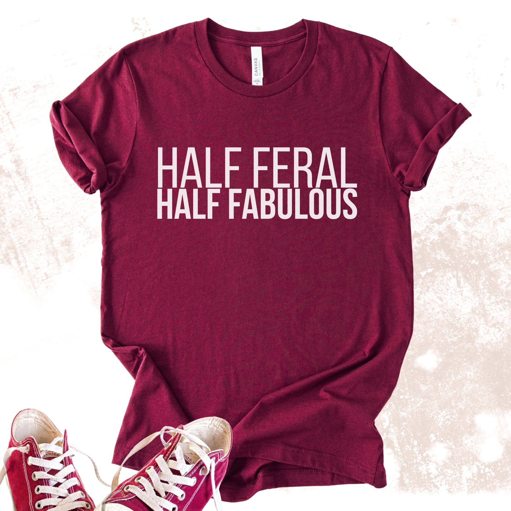 Unisex Zeke Squad T-shirt with the funny phrase “Half Feral Half Fabulous” for unapologetic misfits.