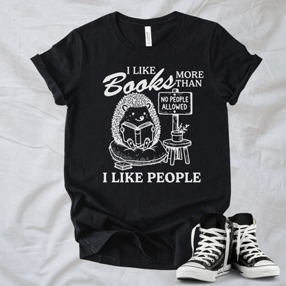 Unisex Zeke Squad T-shirt with the phrase “I Like Books More Than People” featuring a funny animal holding a “No People” sign.