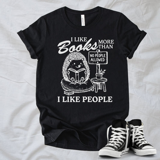 Unisex Zeke Squad T-shirt with the phrase “I Like Books More Than People” featuring a funny animal holding a “No People” sign.