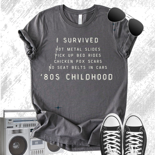Unisex Zeke Squad T-shirt with the phrase “I Survived 80s Childhood” referencing no seat belts, riding in pickup trucks, and chicken pox scars.
