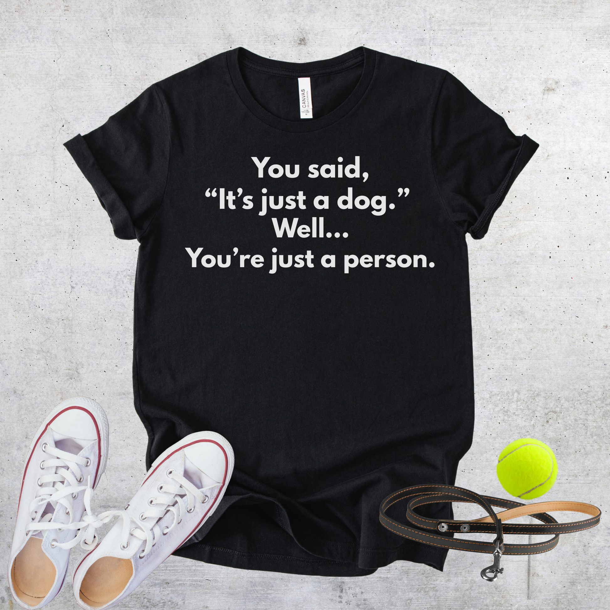 Unisex Zeke Squad T-shirt with the bold quote “You said it’s just a dog, well you’re just a person” for dog lovers.
