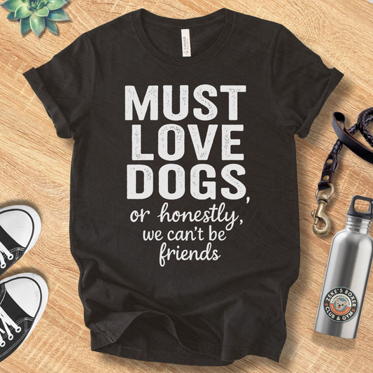 Unisex Zeke Squad t-shirt with the phrase “Must Love Dogs or Honestly, We Can’t Be Friends,” a funny dog-lover design.