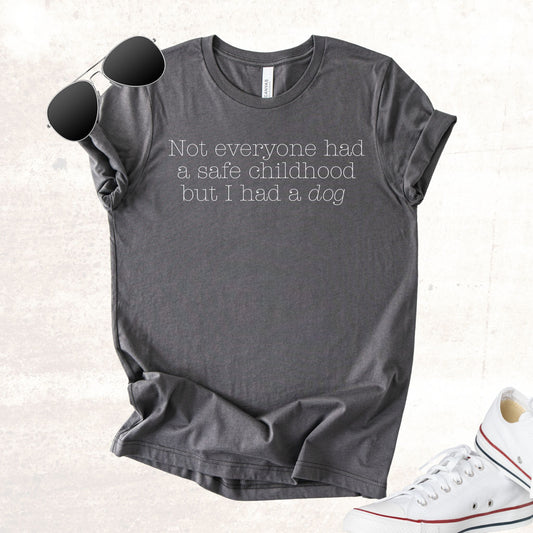Unisex Zeke Squad T-shirt with the phrase “Not everyone had a safe childhood, but we had a dog” for survivors and dog lovers.