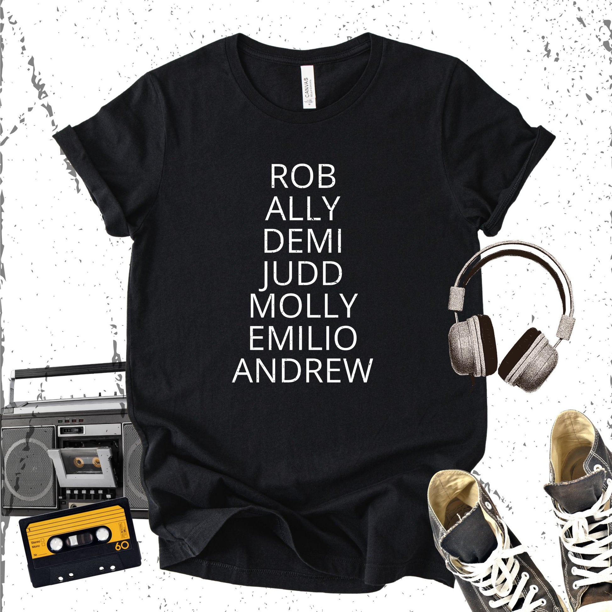 Unisex Zeke Squad T-shirt with the names “Rob, Ally, Demi, Judd, Molly, Emilio, Andrew” in bold retro style, a tribute to 80s Brat Pack movie stars.