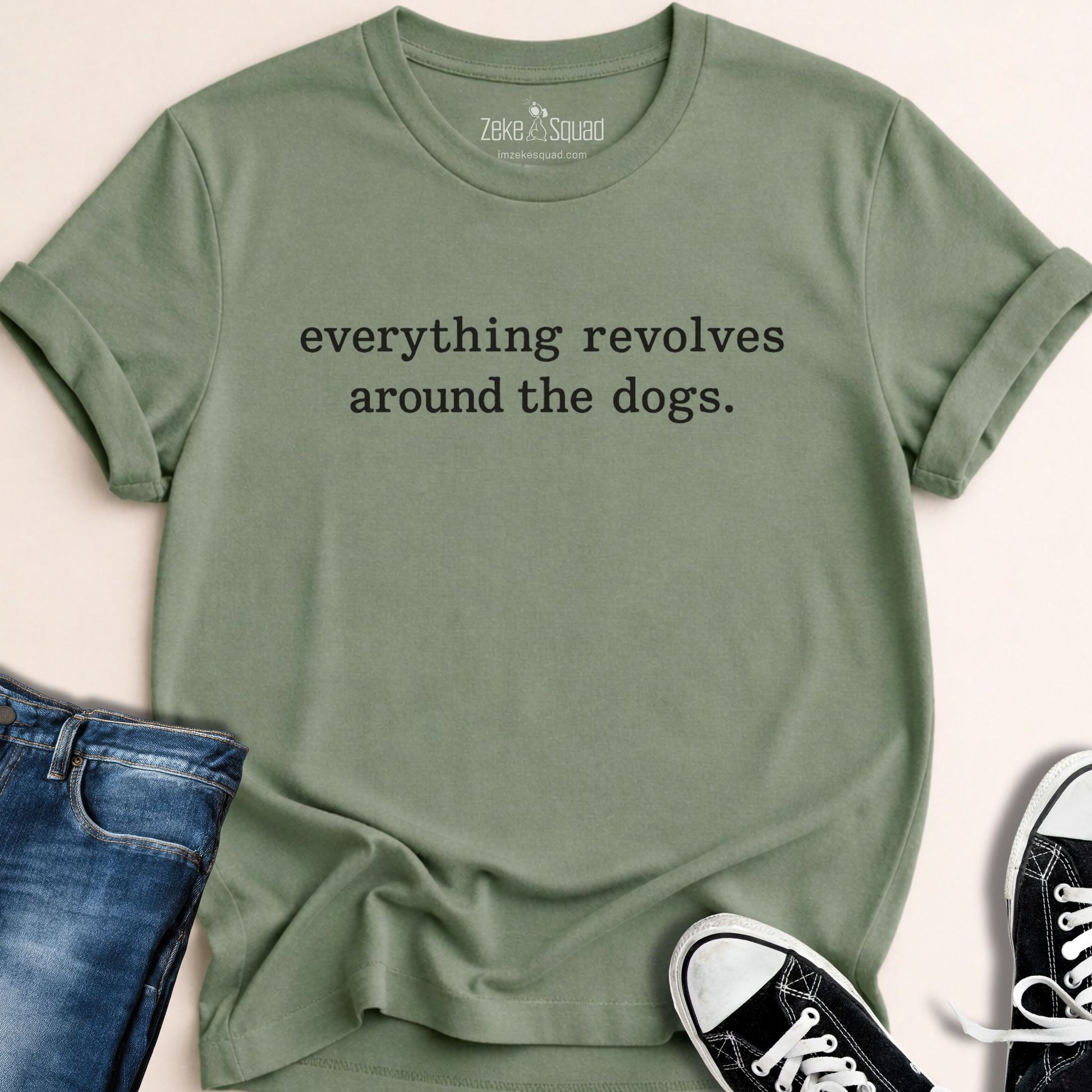 Sage green unisex graphic tee printed with the phrase everything revolves around the dog across the chest, Bella Canvas 3001
