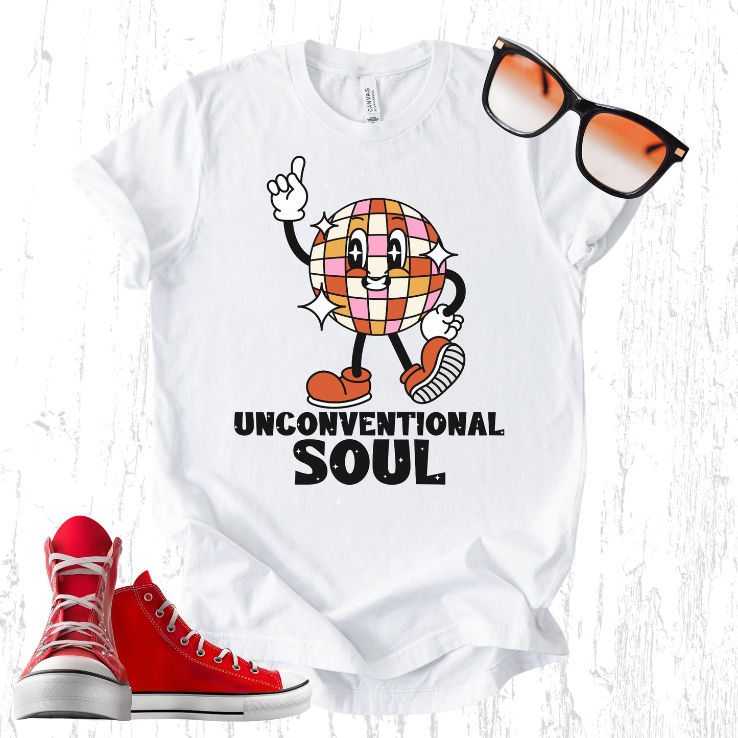 Unisex Zeke Squad T-shirt with the phrase “Unconventional Soul” and a retro disco ball graphic, made for misfits.
