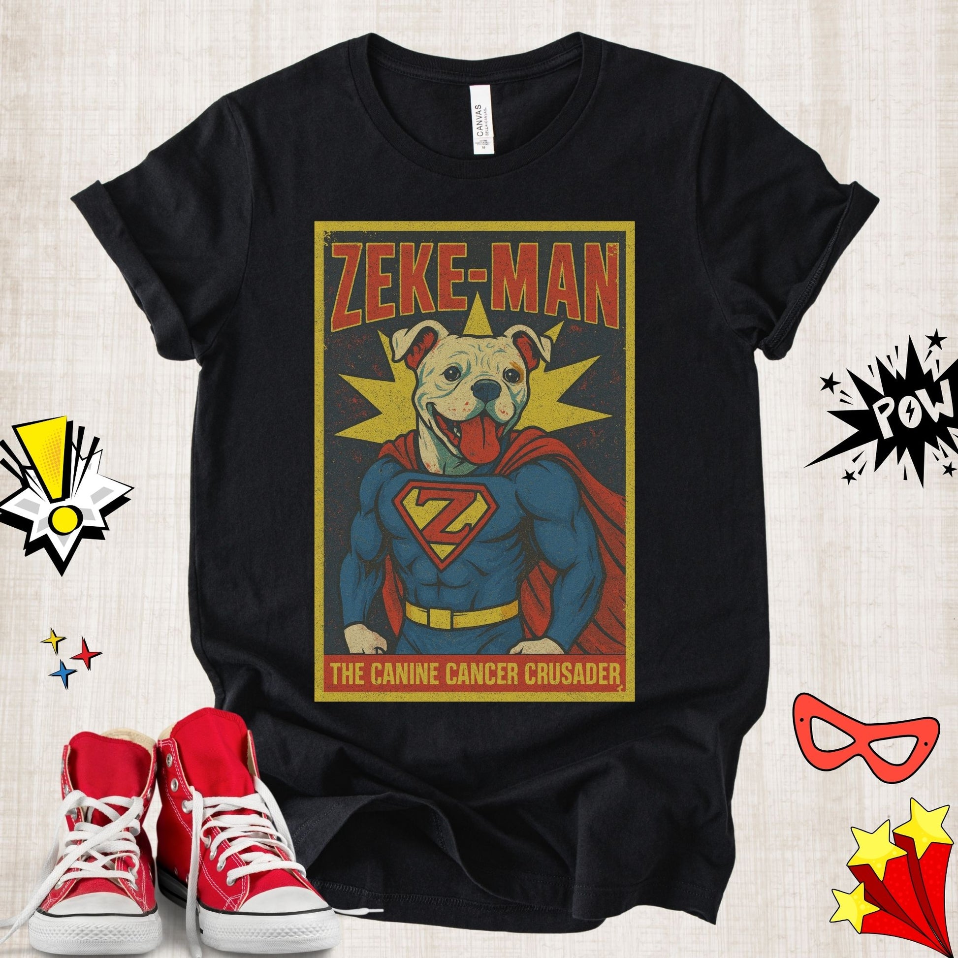 Unisex superhero-inspired Zeke Squad T-shirt with the quote “Zeke-Man the Canine Crusader” honoring dogs fighting canine cancer.
