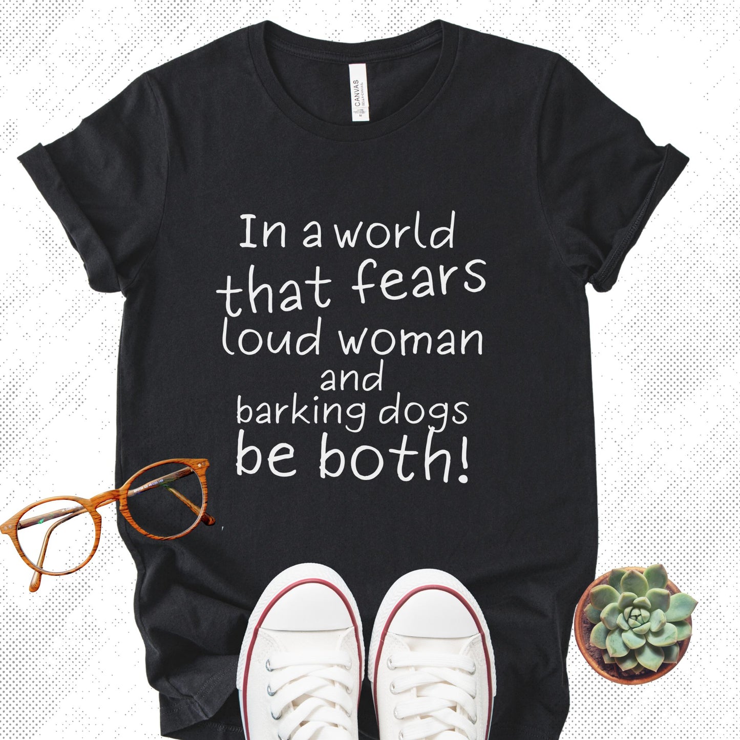 Unisex Zeke Squad T-shirt with the bold statement “In a world that fears loud women and dogs, be both” for unapologetic dog lovers.
