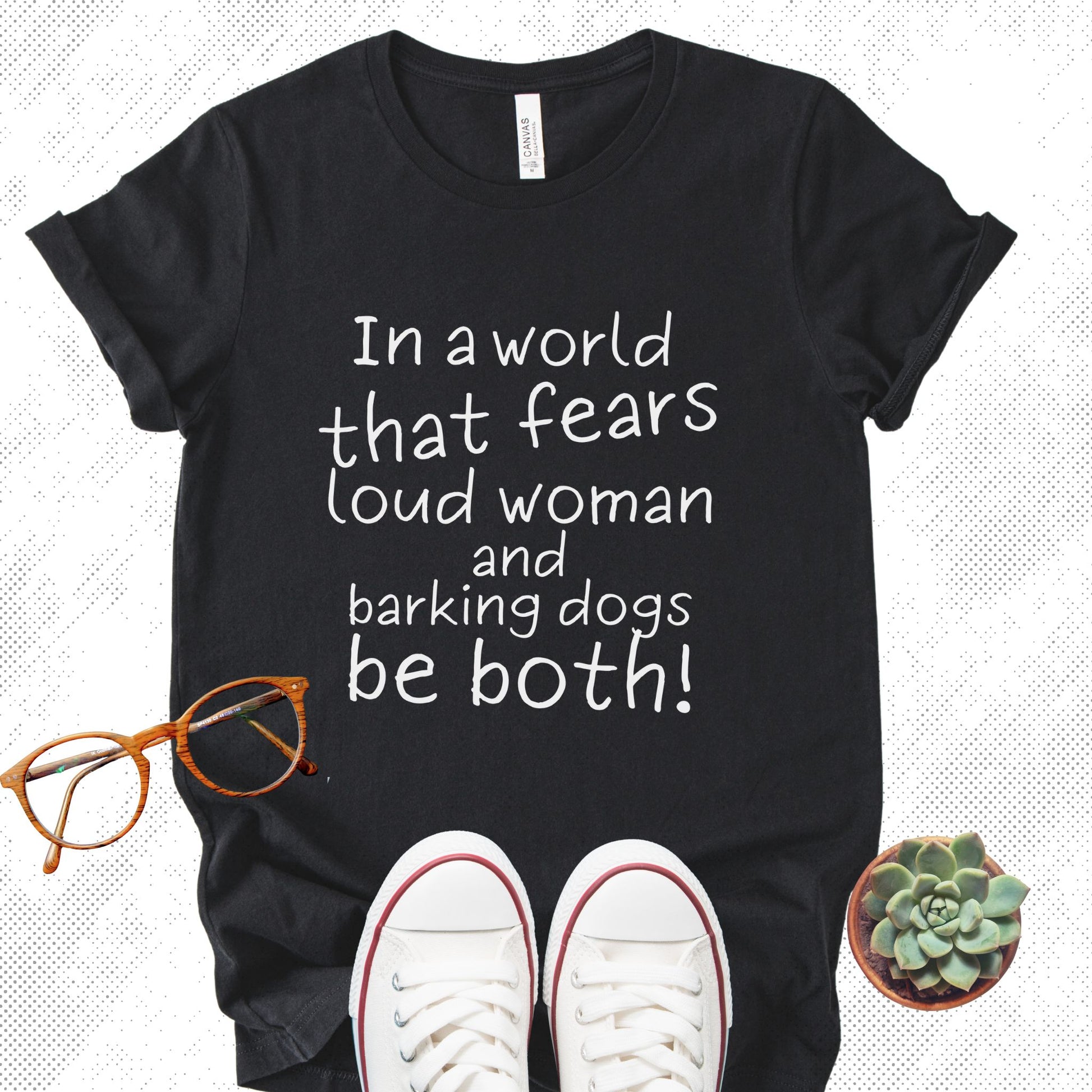 Unisex Zeke Squad T-shirt with the bold statement “In a world that fears loud women and dogs, be both” for unapologetic dog lovers.

