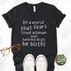 Unisex Zeke Squad T-shirt with the bold statement “In a world that fears loud women and dogs, be both” for unapologetic dog lovers.
